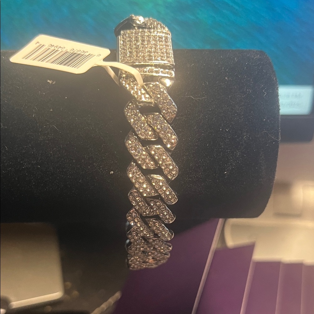 Invicta 7.5 to 8” Silver Rhinestone Bracelet Free with a $50 purchase.